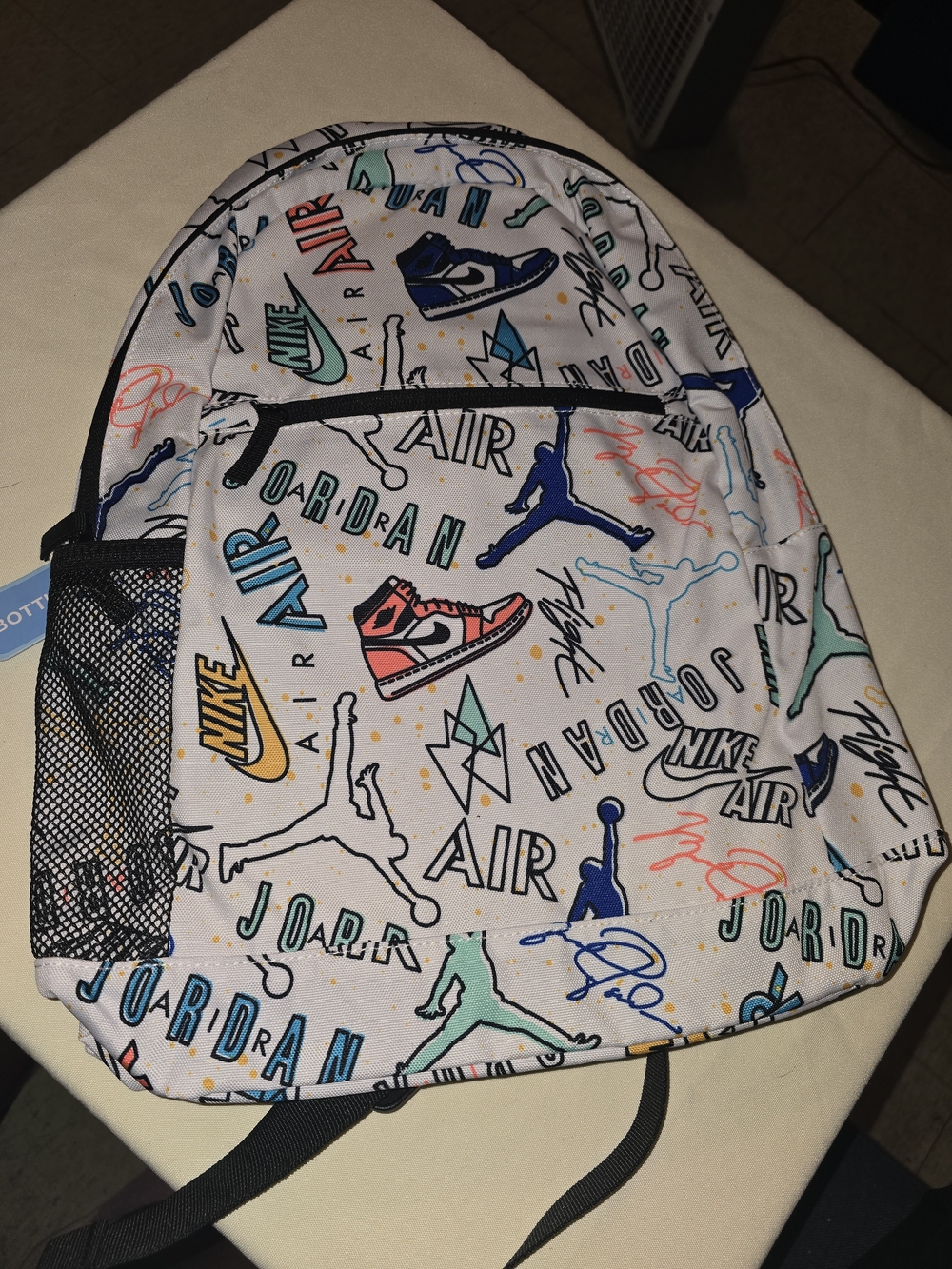 Nike Kids White Backpack with Multicolor Sneaker & Logo Print